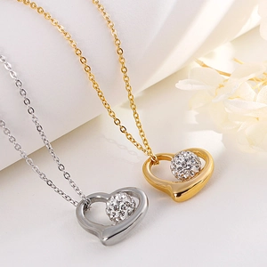 Titanium steel jewelry set with hollow heart pendants in gold and silver finishes