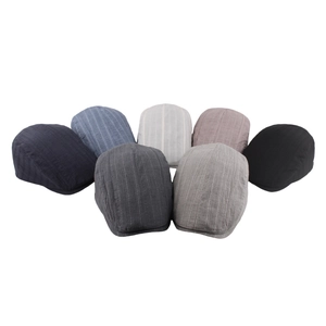 Flat lay display of cotton linen flat caps in seven colors with striped texture design