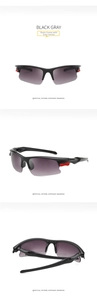 Close-up of semi-rimless sports sunglasses with red details and gray gradient lenses