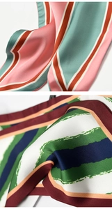 Macro shot of colorful striped silk-textured scarves showing smooth fabric details