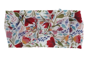 Close-up detail of floral print nylon headband with soft butterfly knot for infants