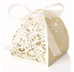 Detail of laser-cut rose patterns and white organza ribbon on beige wedding candy boxes
