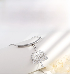 Detail of silver tree of life pendant with polished bar and elegant link chain