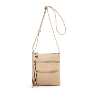 Detail of khaki crossbody bag with three front zipper pockets and decorative tassels