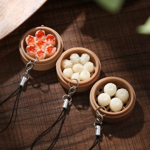 Miniature Dim Sum keychain set with Siu Mai and Dumplings in a bamboo steamer