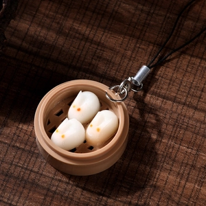 Miniature rabbit steamed bun pendants in small bamboo steamer keychain with black cord