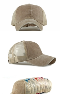 Detail of khaki washed cotton baseball cap with breathable mesh and distressed brim edges