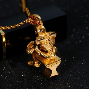 Unique golden skull thinker pendant on twisted chain necklace made of stainless steel