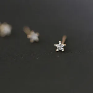 Minimalist 925 sterling silver star stud earrings with 14K gold plating and clear zircons