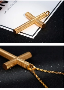 Detailed macro view of golden cross pendant with diamond texture and twist chain