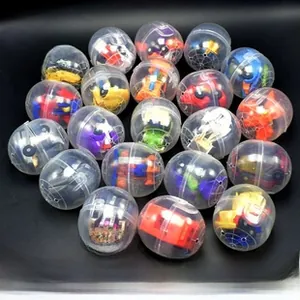 Detailed view of 47x55mm clear plastic capsules containing mini colorful toy cars