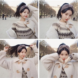 Brown chunky knit headband with twist knot design for women shown on model