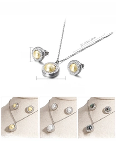 Macro detail of pearl pendant necklace set with stainless steel diamond accents