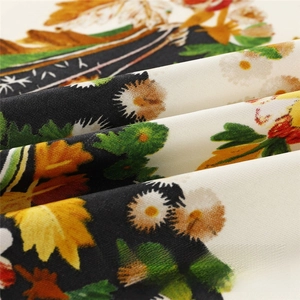 Macro view of silk twill fabric with floral daisy print and refined drape detail