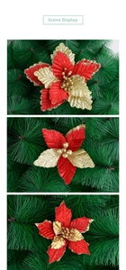 Close-up of artificial red velvet poinsettia flowers with gold glitter and pine branch details