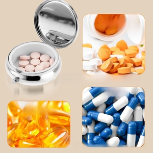 Macro shot of circular metal pill box interior with three compartments for vitamins