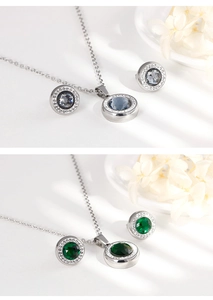 Macro view of crystal pendant and earrings set in grey and green stone variants
