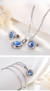 Detailed close-up of blue crystal jewelry set with round halo pendant and stud earrings