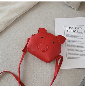 Detail view of red pig cartoon kids crossbody bag made of premium PU leather