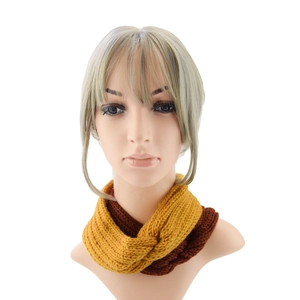 Winter knitted headwrap in yellow and brown patchwork with a stylish cross twist design
