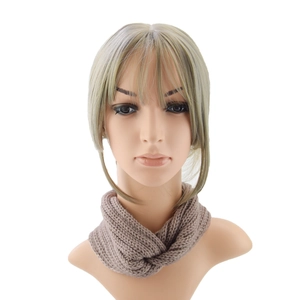 Close-up of khaki knitted headband with cross-knot design and thick woolen texture