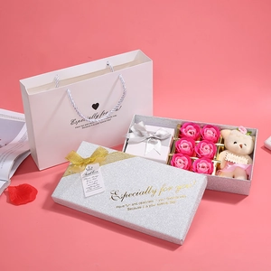 Detail of pink soap rose gift box with teddy bear and silver glitter packaging