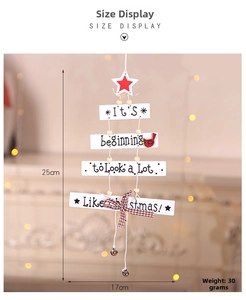 Detail of wooden Christmas tree hanging with red bow, bell and festive greetings