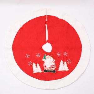 Red Christmas tree skirt with white borders and festive Santa Claus embroidery