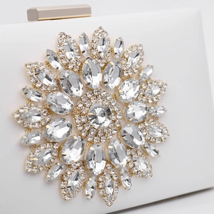 Elegant white evening clutch bag with sparkling floral rhinestone decoration and gold clasp