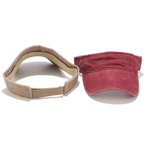 Washed cotton sun visors in red and khaki with adjustable straps and curved brims