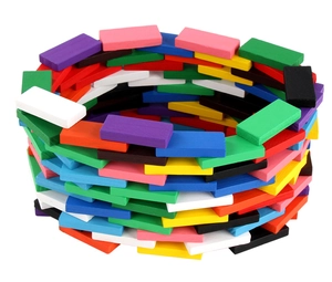 Colorful wooden domino blocks stacked in a circular tower on a clean white background