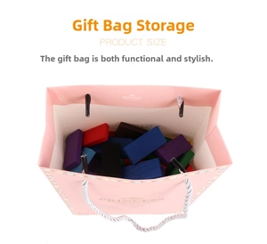 Top view of pink gift bag filled with colorful wooden domino blocks on white background