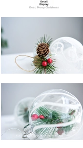Detail view of 6cm clear Christmas ball ornaments with pine cones, needles and red berries