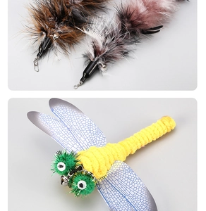Detail of feather and dragonfly cat wand refills with metal hooks and small bells