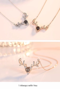 Macro detail of stag antler necklace with 100 languages I love you projection stone