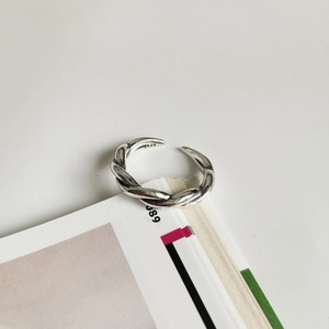 Close-up of S925 sterling silver hallmark on vintage twisted rope textured open ring