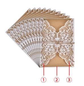 Detail of 10 laser-cut lace wedding invitations with kraft envelopes and twine bows