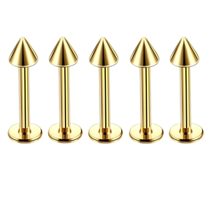 Detail of five gold cone-shaped stainless steel labret studs with flat base backings