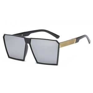 Oversized square sunglasses with black frame and gold metal mesh texture on the temples