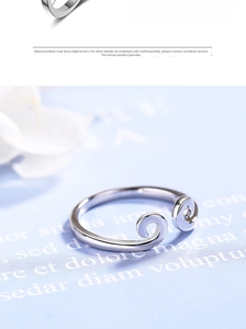 Detailed macro view of silver Monkey King ring with cloud pattern and a small diamond