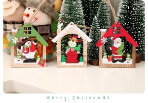 Detailed view of hollow wooden Christmas pendants with snowman and elk figures
