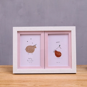 Modern white wood grain double photo frame for 4x6 inch pictures on a wooden desk