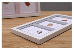 Detail of white 3-window collage photo frame with minimalist Nordic art illustrations