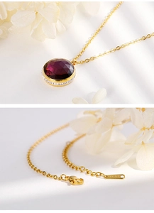 Detailed macro view of gold-plated stainless steel necklace with dark purple zircon stone