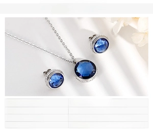 Detailed view of silver stainless steel jewelry set with blue zircons and spec sheet