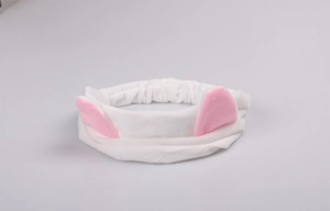 Detail of white plush cat ear headband with soft texture and elastic stretch design
