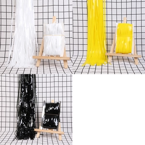 Glossy PET tinsel fringe curtains in white, yellow, and black for party backdrop decoration