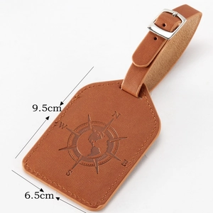 Brown leather luggage tag with compass design and dimensional size markings 9.5x6.5cm