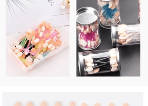 Detail view of bulk disposable double-sided eyeshadow brushes in box and cylinder packaging