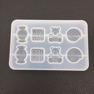 Macro view of 8-cavity silicone mold with bear and text shapes for DIY resin casting